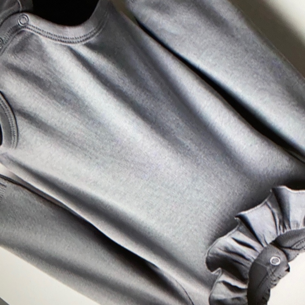 Stylish snap fasteners shoulder one piece
